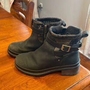 Black zip up ankle Muck Boots.
